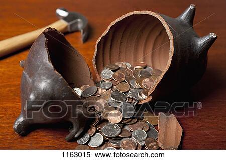 Piggy bank broken open by hammer View Large Photo Image Stock Photography - Piggy bank broken open by hammer. Fotosearch