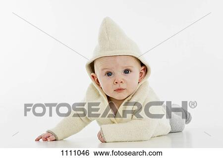Portrait of a baby boy lying on his stomach View Large Photo Image Stock Photograph - Portrait of a baby boy lying on his stomach. Fotosearch