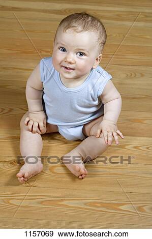 Portrait of a baby sitting View Large Photo Image Stock Photo - Portrait of a baby sitting. Fotosearch