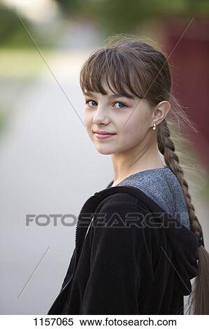 Portrait of a girl looking over her shoulder View Large Photo Image Stock Photography - Portrait of a girl looking over her shoulder. Fotosearch