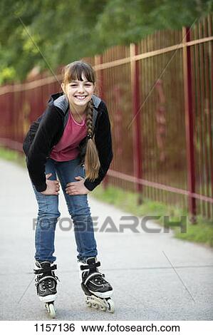 Portrait of a girl on rollerblades View Large Photo Image Stock Photograph - Portrait of a girl on rollerblades. Fotosearch
