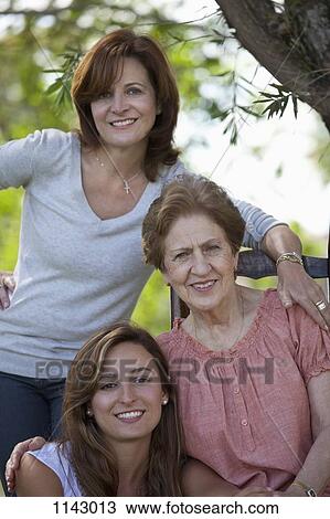 Stock Image - Portrait of a woman with her daughter and granddaughter. Fotosearch