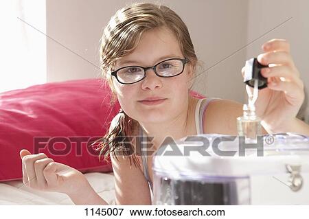 Portrait of girl doing her nails View Large Photo Image Stock Photo - Portrait of girl doing her nails. Fotosearch