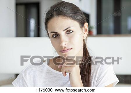 Stock Image - Portrait of pensive woman. Fotosearch