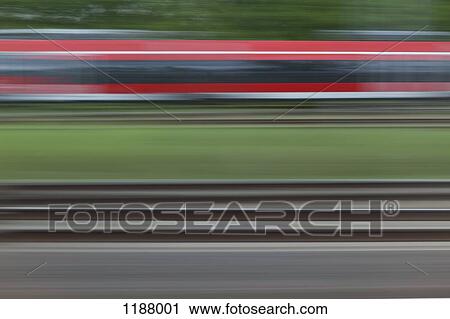 Railroad tracks and a train, blurred motion, viewed from a moving train View Large Photo Image Stock Image - Railroad tracks and a train, blurred motion, viewed from a moving train. Fotosearch