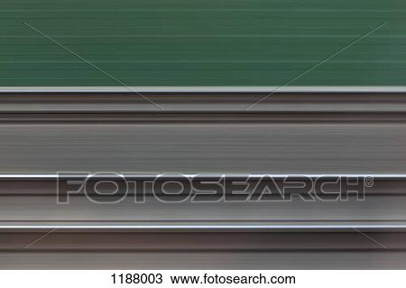 Railroad tracks viewed in abstract blurred motion from moving train View Large Photo Image Stock Image - Railroad tracks viewed in abstract blurred motion from moving train. Fotosearch