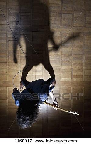 Rock guitarist in the spotlight View Large Photo Image Stock Photo - Rock guitarist in the spotlight. Fotosearch
