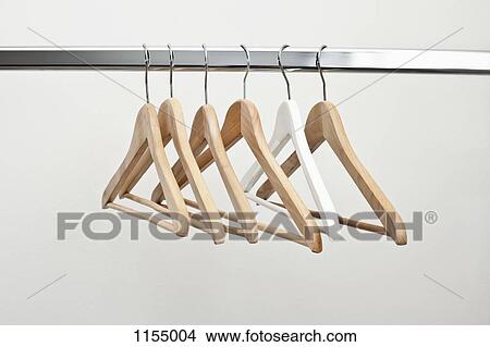 Row of coat hangers View Large Photo Image Picture - Row of coat hangers. Fotosearch