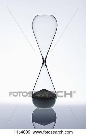Sand at the bottom of an hourglass View Large Photo Image Stock Photo - Sand at the bottom of an hourglass. Fotosearch
