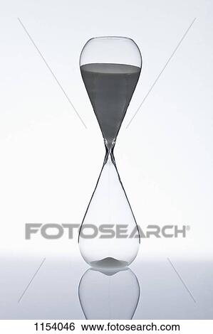Sand beginning to run through an hourglass View Large Photo Image Stock Photograph - Sand beginning to run through an hourglass. Fotosearch