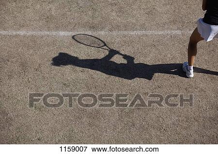 Stock Photo - Shadow of tennis player. Fotosearch