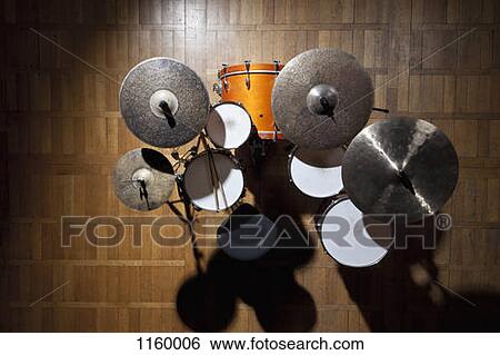 Shadowed drum kit on stage in spotlight View Large Photo Image Stock Photograph - Shadowed drum kit on stage in spotlight. Fotosearch