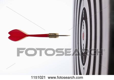 Side view of a dart flying towards the bull's eye of a target View Large Photo Image Stock Image - Side view of a dart flying towards the bull's eye of a target. Fotosearch