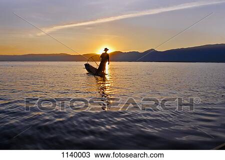 Silhouette of a person on a boat, Inle Lake, Burma View Large Photo Image Stock Image - Silhouette of a person on a boat, Inle Lake, Burma. Fotosearch