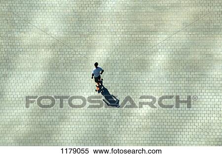 Skater below on plaza View Large Photo Image Stock Photography - Skater below on plaza. Fotosearch