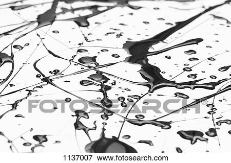 Splattered black paint making a complex abstract pattern on a white surface View Large Photo Image Stock Photo - Splattered black paint making a complex abstract pattern on a white surface. Fotosearch