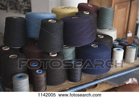 Spools of cotton on a workbench View Large Photo Image Stock Photography - Spools of cotton on a workbench. Fotosearch