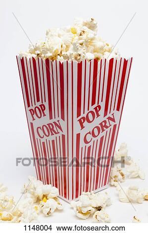 Studio shot of a red striped carton of popcorn with Popcorn printed on it View Large Photo Image Picture - Studio shot of a red striped carton of popcorn with Popcorn printed on it. Fotosearch