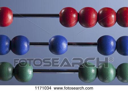 The red, blue and green beads of an abacus, close-up View Large Photo Image Picture - The red, blue and green beads of an abacus, close-up. Fotosearch