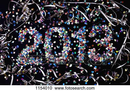 Stock Image - The year 2013 spelled out with confetti and surrounded by streamers. Fotosearch