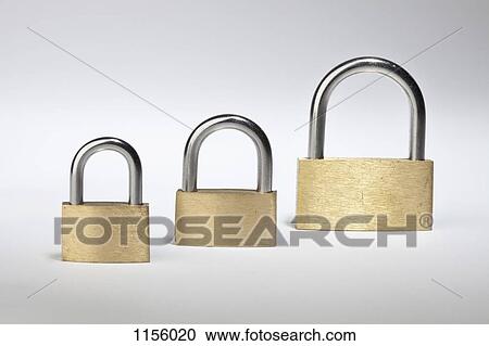 Three different sized padlocks in a row View Large Photo Image Stock Image - Three different sized padlocks in a row. Fotosearch