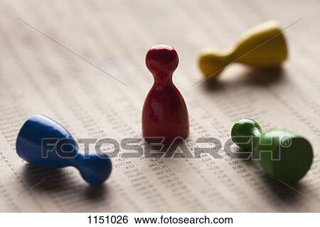 Three game pieces knocked over surrounding a standing red piece View Large Photo Image Stock Photograph - Three game pieces knocked over surrounding a standing red piece. Fotosearch