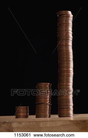 Three rows of stacks of copper coins increasing in size View Large Photo Image Stock Image - Three rows of stacks of copper coins increasing in size. Fotosearch