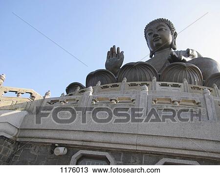 Tian Tan Buddha, or "Big Buddha" located on Lantau Island in Hong Kong View Large Photo Image Stock Image - Tian Tan Buddha, or "Big Buddha" located on Lantau Island in Hong Kong. Fotosearch