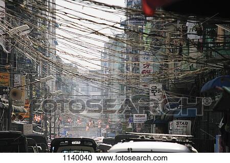Stock Image - Traffic on a city street in Yangon, Burma. Fotosearch