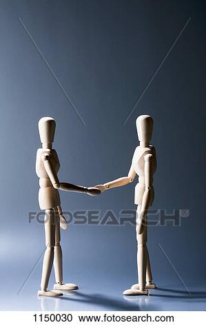 Two artist's figures shaking hands View Large Photo Image Stock Image - Two artist's figures shaking hands. Fotosearch