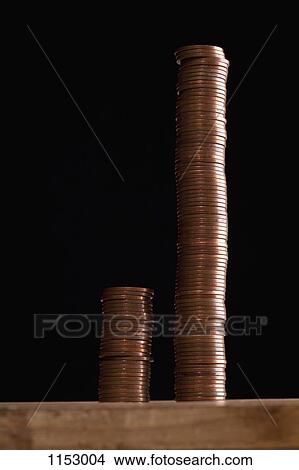 Two different sized stacks of copper coins side by side View Large Photo Image Picture - Two different sized stacks of copper coins side by side. Fotosearch