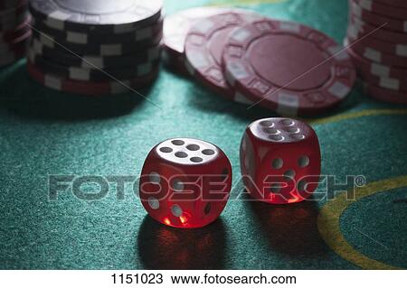 Two rolled sixes on a craps table, gambling chips in the background View Large Photo Image Stock Image - Two rolled sixes on a craps table, gambling chips in the background. Fotosearch