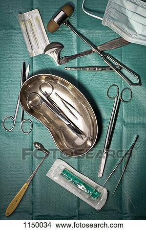 Picture - Various surgical instruments on a surgical drape. Fotosearch
