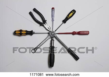 Various tools arranged in a circle, connected at the center View Large Photo Image Stock Image - Various tools arranged in a circle, connected at the center. Fotosearch
