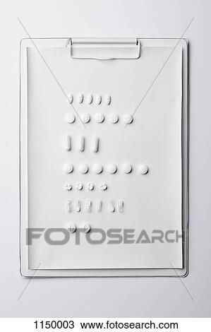 Various white pills and capsules in rows on a clipboard View Large Photo Image Stock Image - Various white pills and capsules in rows on a clipboard. Fotosearch