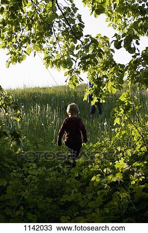 View of two boys walking up a hill View Large Photo Image Stock Image - View of two boys walking up a hill. Fotosearch