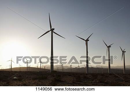 Wind turbines in a desert landscape View Large Photo Image Stock Photograph - Wind turbines in a desert landscape. Fotosearch