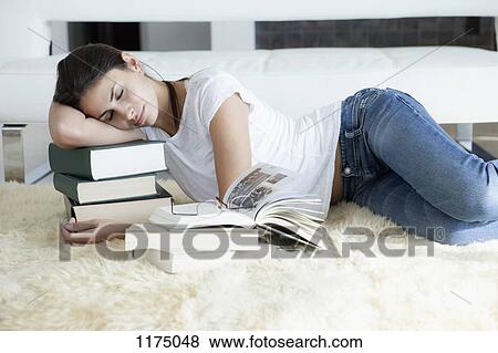 Woman sleeping on her books View Large Photo Image Stock Photo - Woman sleeping on her books. Fotosearch