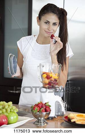 Woman with fruit blender View Large Photo Image Stock Image - Woman with fruit blender. Fotosearch