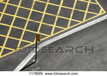 Yellow lines on the street to mark no-stopping area near a red light/crossing View Large Photo Image Stock Photography - Yellow lines on the street to mark no-stopping area near a red light/crossing. Fotosearch