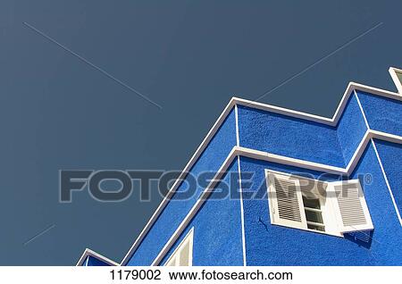 Stock Image - Zigzag pattern of outline of house against clear sky. Fotosearch