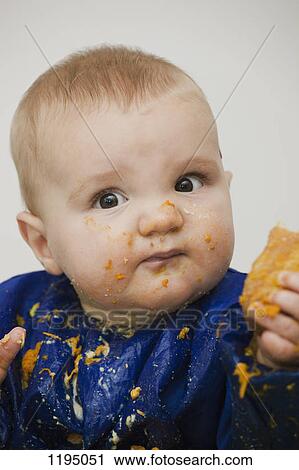 A baby boy with food on his face View Large Photo Image Stock Image - A baby boy with food on his face. Fotosearch