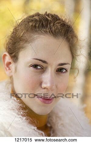 Stock Photography - A beautiful woman wearing a fake fur collar. Fotosearch
