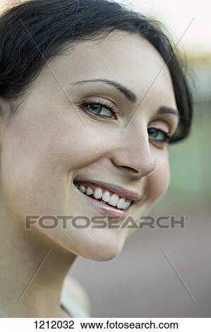A beautiful young woman looking flirtingly into the camera View Large Photo Image Stock Image - A beautiful young woman looking flirtingly into the camera. Fotosearch