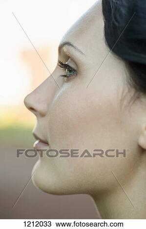 A beautiful young woman looking thoughtfully off camera View Large Photo Image Stock Image - A beautiful young woman looking thoughtfully off camera. Fotosearch