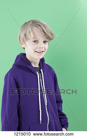 A boy in a purple hooded sweatshirt smiling at camera View Large Photo Image Stock Image - A boy in a purple hooded sweatshirt smiling at camera. Fotosearch