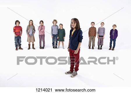 A boy standing in front of a line of kids View Large Photo Image Stock Image - A boy standing in front of a line of kids. Fotosearch