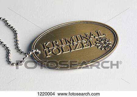 A brass badge with Kriminal Polizei, German for Crime Police View Large Photo Image Picture - A brass badge with Kriminal Polizei, German for Crime Police. Fotosearch