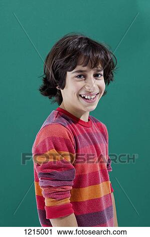 A cheerful preadolescent boy smiling at the camera View Large Photo Image Stock Image - A cheerful preadolescent boy smiling at the camera. Fotosearch