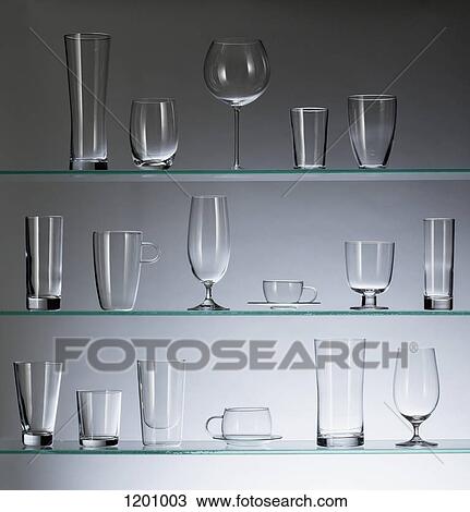 A collection of various types of drinking glasses arranged neatly on three shelves View Large Photo Image Stock Image - A collection of various types of drinking glasses arranged neatly on three shelves. Fotosearch